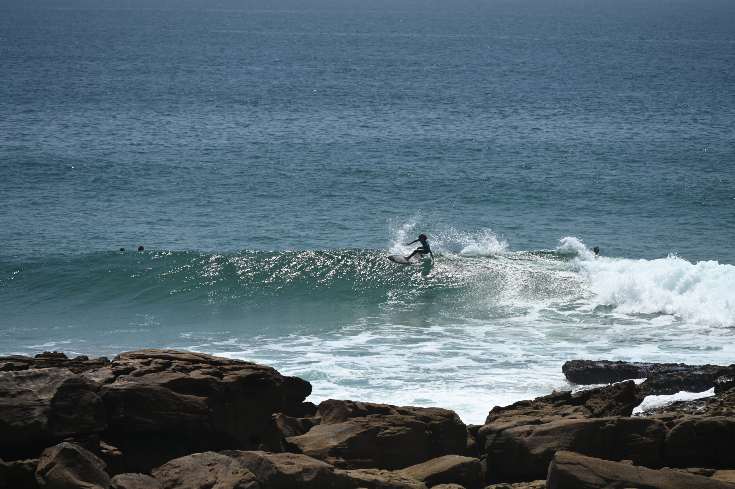 Surfer hitting the lip at Anchor Point